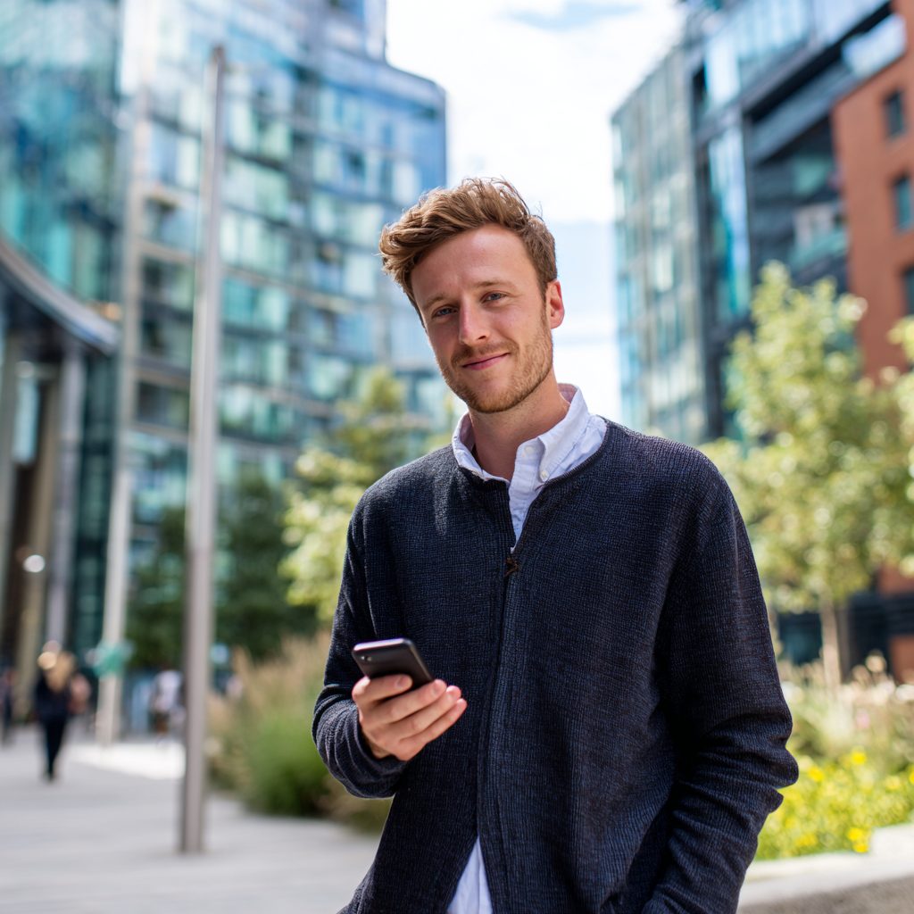 Man applying for a 12 month loan on his smartphone
